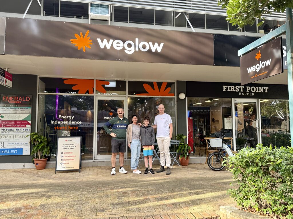 Weglow team standing outside the company's renewable energy showroom and office in Queensland, Australia.
