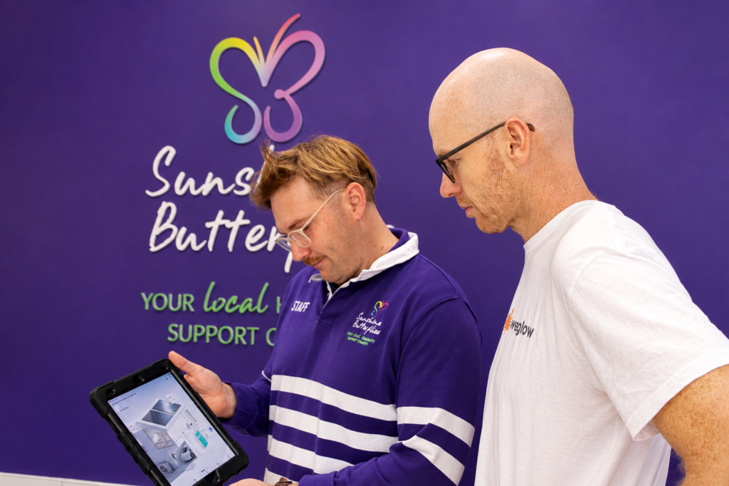Weglow and Sunshine Butterflies representatives reviewing project information together on the Sunshine Coast, Queensland.