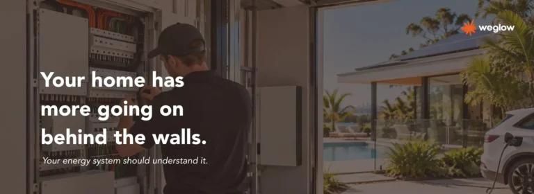 Technician inspecting an electrical switchboard at a premium Queensland home